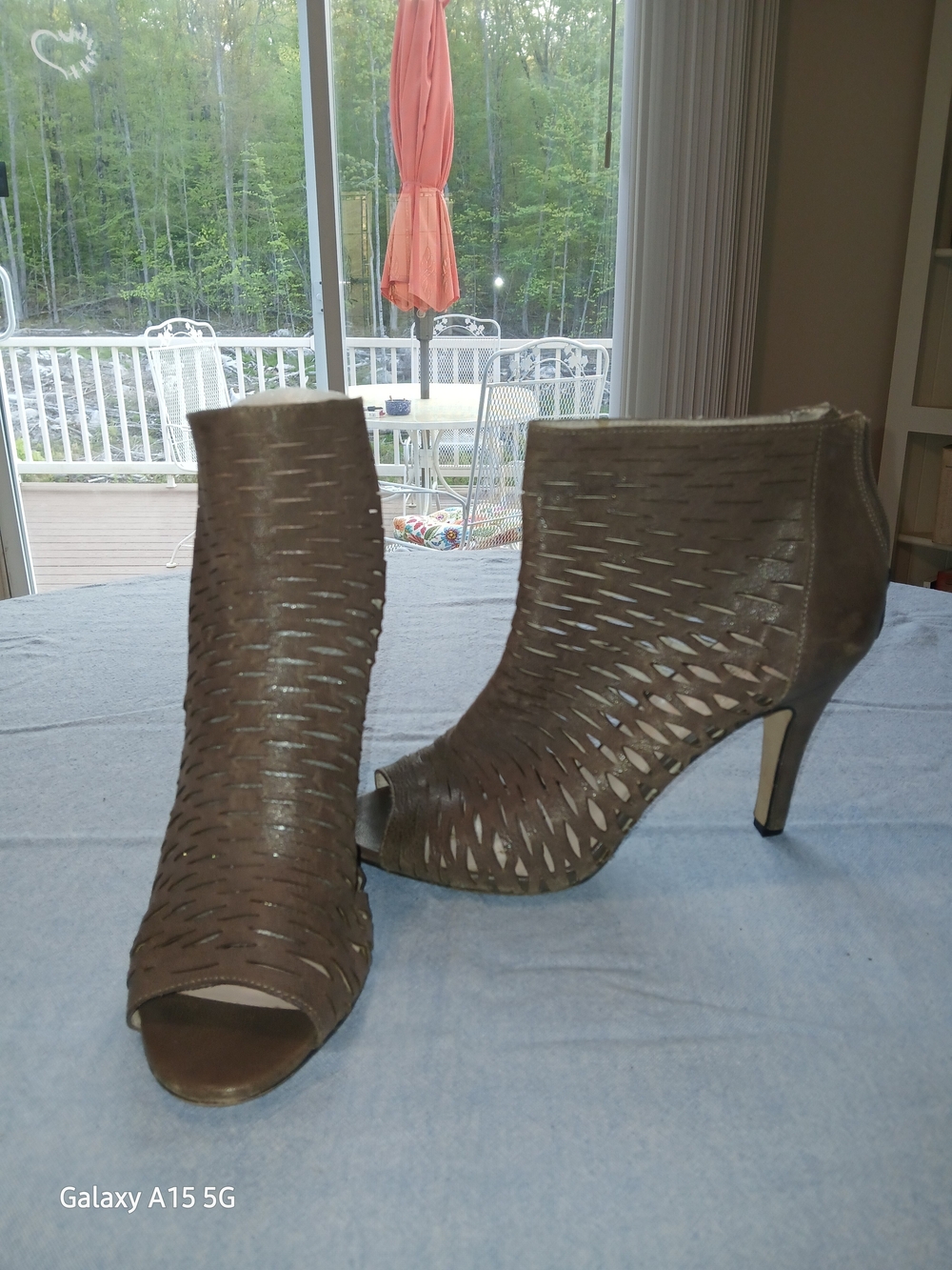 Vince Camuto laser-cut lattice peep-toe ankle boots with a back zipper